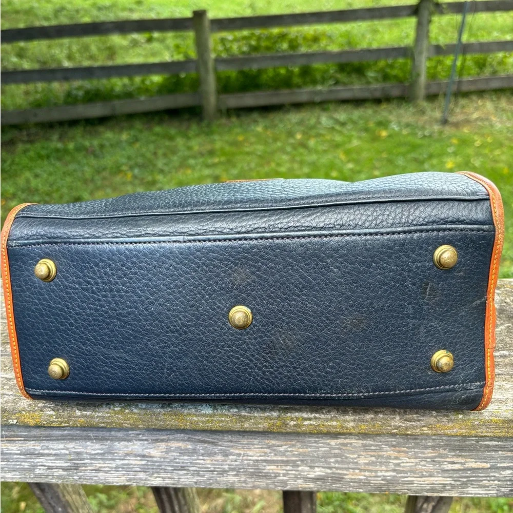 Dooney and Bourke Classic Black and Tan Vintage Leather Handbag